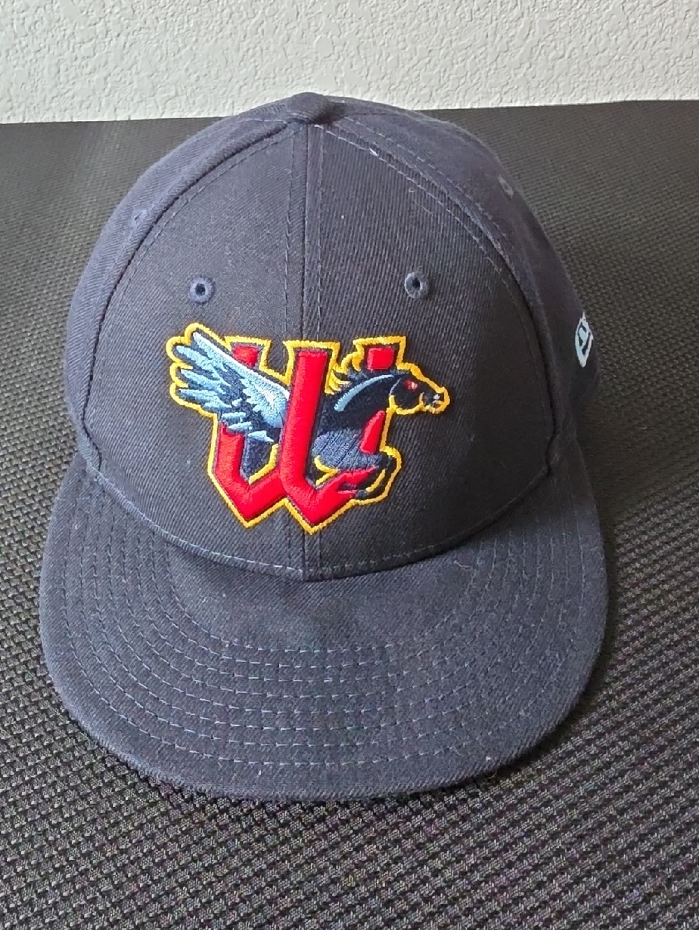 New Era Navy Blue Baseball Cap with Red and Yellow Embroidered Logo